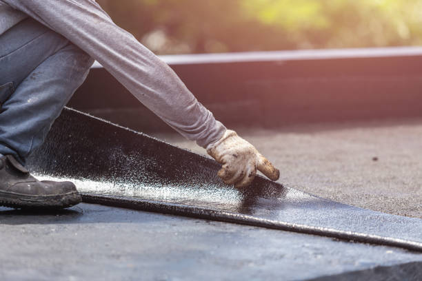 Professional Basement Waterproofing technician working in Williamsburg, OH